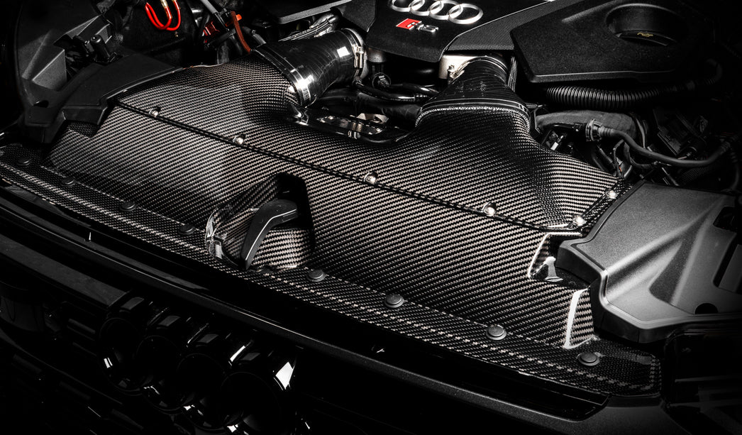 Audi R8 with cold air intake sits in a cloud of tire smoke